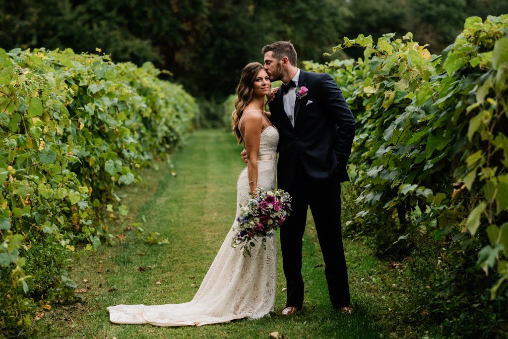 bride and groom in a vineyard